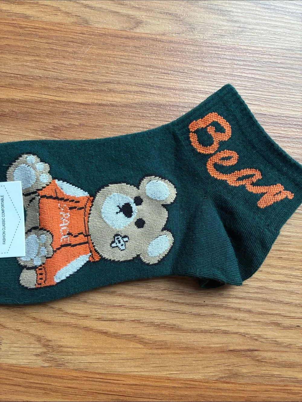 mark. Dark Green Socks with Orange Bear Accent
